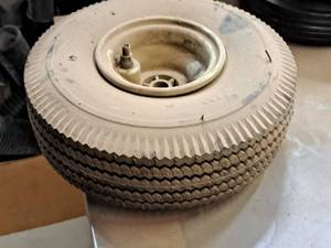 lot 402 image: Replacement 10x4 Tire on 4-12 Rim