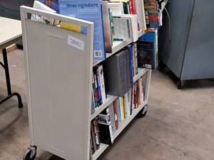 lot 458 image: Rolling Book Shelf with Books