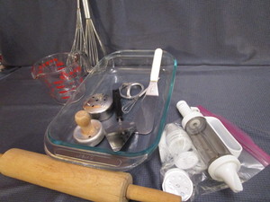 lot 84 image: Baking Pyrex Pan & Meas. Cup, Cookie Press, Cutters, Whips