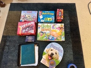 lot 136 image: Variety of Childrens Games - Planes Matching Game, Dr Seuss Matching Game, Memory Mayhem, Chutes and Ladders, Dinosaur Art Kit, I Love Puppies Kit & Yahtzee