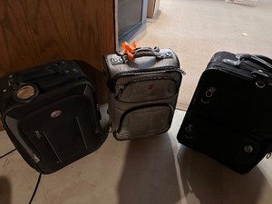 lot 415 image: Three Soft Sided Rolling Suitcases