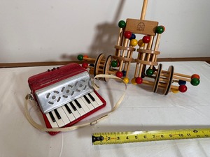lot 354 image: Spinning Wooden Push Toy The Neat New Toy by Kinderworks, FAO Schwartz and Vintage Childrens Accordian