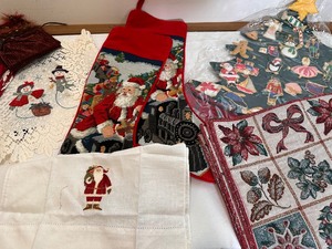 lot 396 image: Two Christmas Needlepoint Stockings, New Christmas Tree Advent Calendar, Table Clothes, Runners, Dish Towels