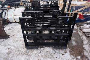 lot 24 image: Brand New Made In America Universal Mount Bobcat Skid Loader Skid Steer Walk Through Pallet Fork Attachment