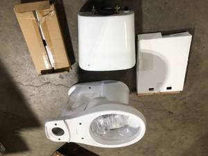 lot 10 image: Glacier Bay 2-piece 1.1 GPF1.6 GPF Dual Flush Round Toilet in White, Seat Included    Customer Returns See Pictures