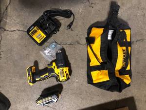 lot 33 image: DEWALT ATOMIC 20V MAX Cordless Brushless Compact 12 in. DrillDriver, (2) 20V 1.3Ah Batteries, Charger and Bag   Customer Returns See Pictures