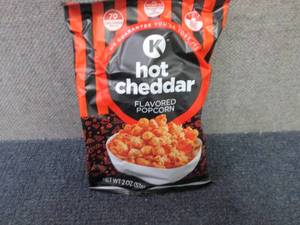 lot 300 image: 12- 2 oz Hot Cheddar Flavored Popco...