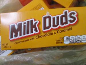 lot 323 image: 12- 5 oz Milk Duds...