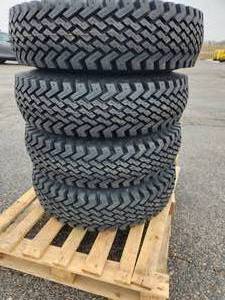lot 49 image: Lot of (4) SnowWolf Series 100 7.50-16 NHS LR E10 Tires (New) on WolfPaws Rims (used)