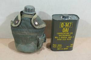 lot 59 image: Vintage US Army Canteen with Insulated Jacket and Oil Can