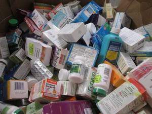 8-10 gallon metal can full of assorted retail OTC overstock products (products filled at random and may vary from pictures)
