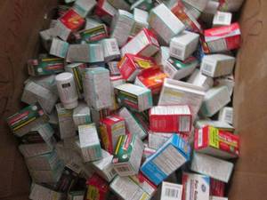 Metal 8-10 gallon bin loaded with a large assortment of retail OTC overstock (products filled at random and may vary from pictures)