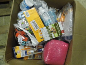 Heavy box of dog health care and grooming supplies
