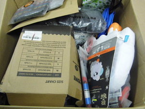 Box of Assorted dog clothing, toys, harnesses and other supplies