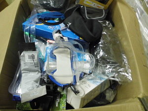 Box of swim and bicycle related supplies and accessories