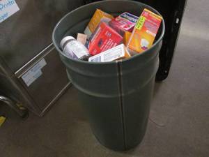 Metal 8-10 gallon bin loaded with a large assortment of retail OTC overstock (products filled at random and may vary from pictures)
