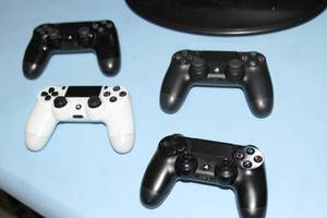 lot 6 image: Sony PS4 Play Station 4 PlayStation 4 Video Game Console System with Remote Controls Games and More
