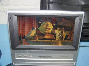 lot 124 image: 5 Panasonic Portable DVD & CD Player and Numerous DVDs - Mostly Child-Themed Videos