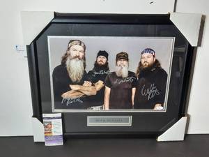 lot 105 image: Signed Authenticated Duck Dynasty Photo, signed by Phil, Si, Willie and Jase Robertson. Professionally framed