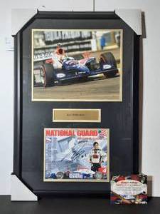 lot 104 image: Signed Authenticated&nbspNational Guard Indy Car Series Photo of Dan Wheldon #4 Panther Racing, professionally framed.