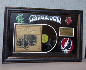 lot 40 image: Warmer Bros. Certified Platinum Record The Grateful Dead Workingmans Dead, Released June 4, 1970, framed
