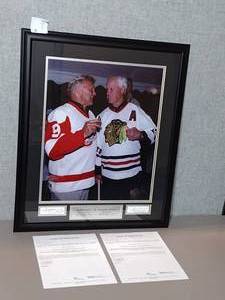 lot 49 image: Signed Authenticated Photo of NHL Hall of Fame Players Bobby Hull 1983 and Gordie Howe 1972. Framed.