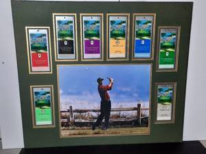 lot 227 image: Tiger Woods Wins June 11 2002 U.S. Open. Photo is surrounded by Daily Trophy Club Tickets and Playoff Ticket