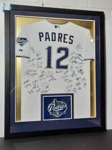 lot 19 image: Team-signed Padres #12 Jersey, framed
