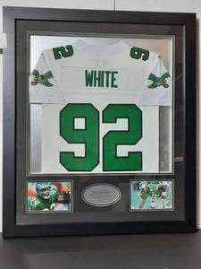 lot 181 image: Reggie White #92 Jersey, NFL Hall of Fame 2006 Minister of Defense, framed.