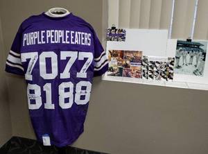 lot 7 image: Authenticated Signed Purple People Eater Jersey Jim Marshall, Carl Eller, Gary Larsen, Alan Page.  Photos