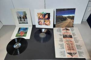 lot 333 image: (3) LP Vinyl 1975 Pink Floyd Wish You Were Here 1986 Poison Look What the Cat Dragged In 2012 The Young Dub Egg