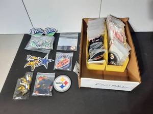 lot 396 image: Football Logo Badges Giants, Chargers, San Francisco 49ers, Steelers, Saints, Minnesota Vikings, Bears, Lions, Patriots