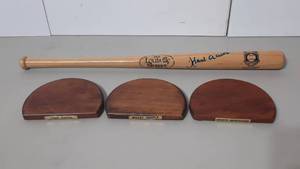 lot 407 image: Louisville Slugger Bat signed Hank Aaron. (3) display shelves w name plates Hank Aaron, Mickey Mantle, Sports Impressions.