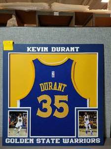 lot 315A image: Collage of Kevin Durant #35 Golden State Warriors Jersey and Photos. Professionally matted. 32 x 32