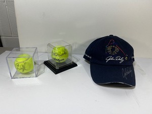 lot 498 image: Signed Hat Golf Legend John Daly. (2) Signed Tennis Balls in display case.