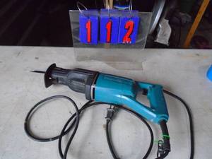 Makita 110 volt reciprocating saw. Used condition. As shown.