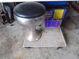 Roller stool on aluminum diamond plate. As shown.