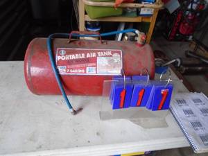 Portable air tank. As shown.