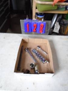 Flat of ratchet & sockets. As shown.