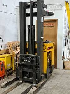 lot 1 image: Caterpillar 4000-lbs 36V 840 Ah Standing Fork Lift NRR40 with VPII 36VDC 3-Phase 600Ah LA Battery Charger EMP18-600B3