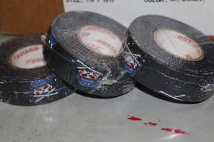lot 1659 image: Lot of (14 Rolls) Black Skulls N Sticks pattern Hockey Tape 1x20yd