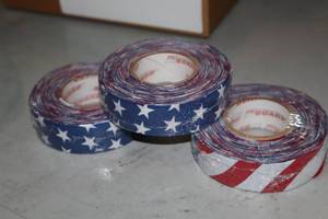 lot 1805 image: Lot of (12 Rolls) ProGuard USA Flag Hockey Tape 1x20yd