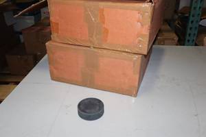 lot 2418 image: Lot of (2 Boxes) Unprinted Hockey Pucks 100-count ( 200 total items )
