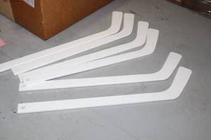 lot 2598 image: Lot of (15) 18 White Plastic Hockey Sticks