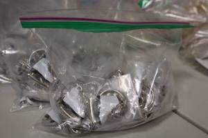 lot 3884 image: Lot of (25) White Figure Skate Keychains