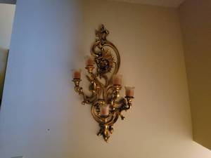 Ornate gold wall decor with 5 candle holders
