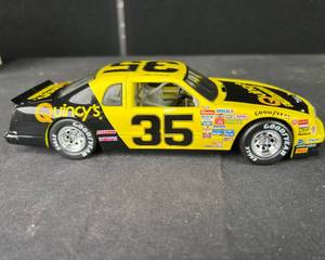 lot 14 image: 124 Die Cast Action Racing Collectables 1986 Kulwicki Steak House Thunderbird NOS