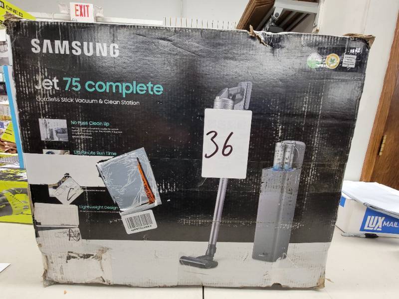 lot 36 image: SAMSUNG Jet 75 Complete Cordless Stick Vacuum Cleaner w Clean Station, Removable Battery, Lightweight, Powerful Cleaning VS20T7551P5AA, Silver -  Slightly Used, Tested and Works Great