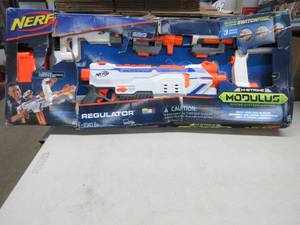 lot 121 image: Nerf Modulus Regulator Fully Motorized Blaster, 3 Firing Modes, 2X 12-Dart Clips, 24 Nerf Elite Darts, Nerf Full Auto Blaster, Box Damaged During Shipping, Did not appear to be damaged, May be missing parts.
