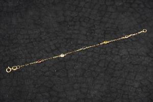 lot 124 image: Baby Bracelet with Colored Stones - 18K Yellow Gold